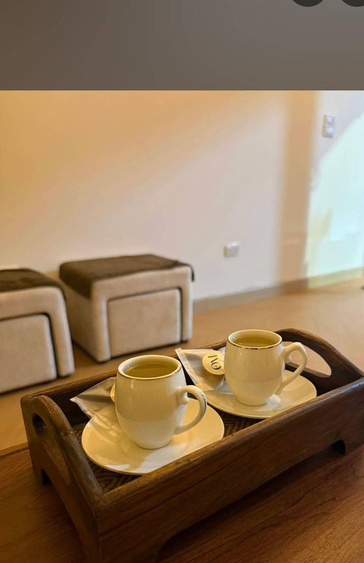 Welcome herbal tea served on a wooden tray